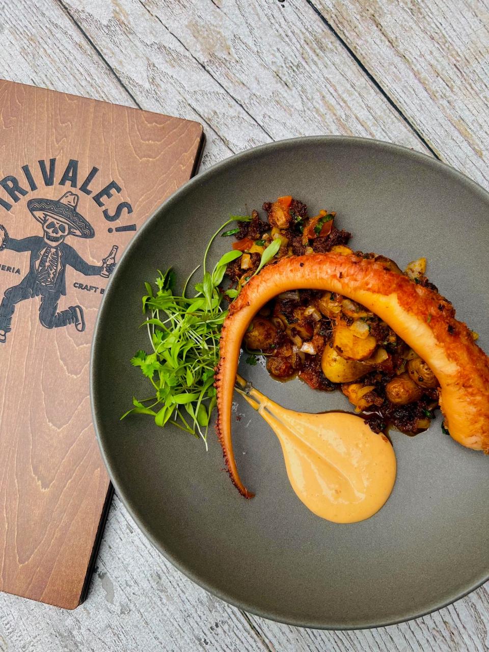 On the menu at Rivales Taquería in West Palm Beach: tender Octopus served with chorizo, home-fried potatoes and a chipotle sauce.