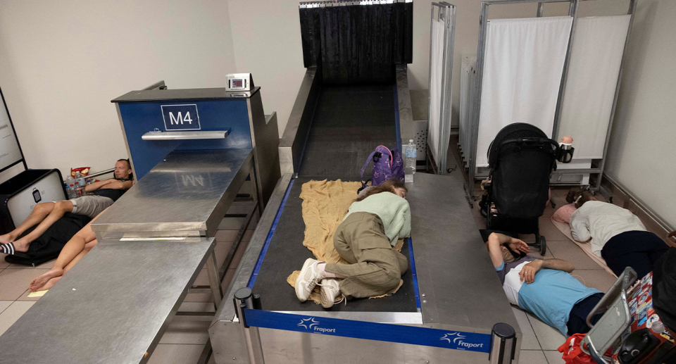 Tourists sleeping on the ground inside Rhodes airport.