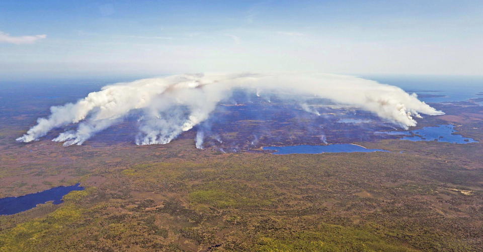 In this aerial image, wildfires burn in Shelburne County, Nova Scotia, on Wednesday, May 31, 2023. (Communications Nova Scotia/The Canadian Press via AP)