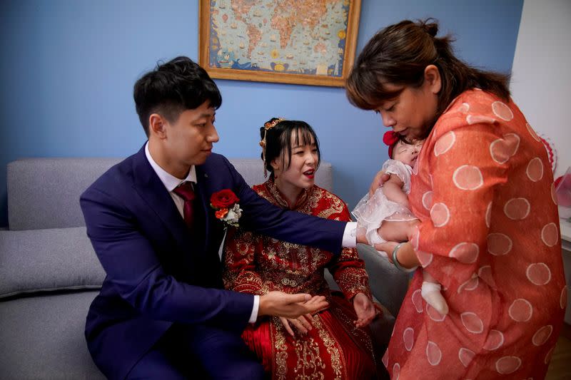 The Wider Image: Coronavirus dampens celebrations in China's wedding gown city