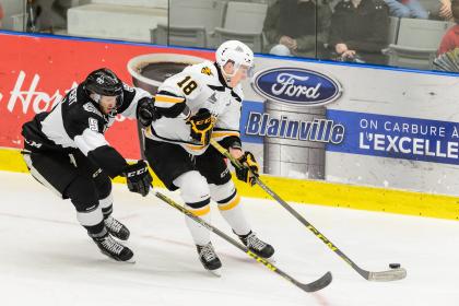 BLAINVILLE-BOISBRIAND, QC - DECEMBER 06:  Nathanael Halbert #5 of the Blainville-Boisbriand Armada challenges Pierre-Luc Dubois #18 of the Cape Breton Screaming Eagles during the QMJHL game at the Centre d&#39;Excellence Sports Rousseau on December 6, 2015 in Blainville-Boisbriand, Quebec, Canada.  (Photo by Minas Panagiotakis/Getty Images)