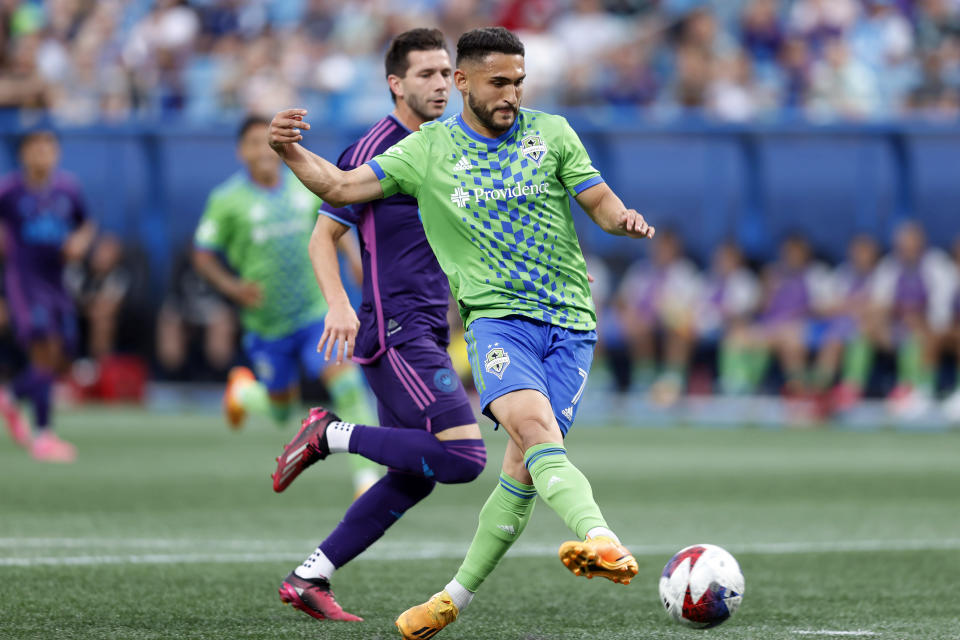 Seattle Sounders midfielder Cristian Roldan (7) scores a goal during an MLS soccer match against the Charlotte FC, Saturday, June 10, 2023, in Charlotte, N.C. (AP Photo/Brian Westerholt)