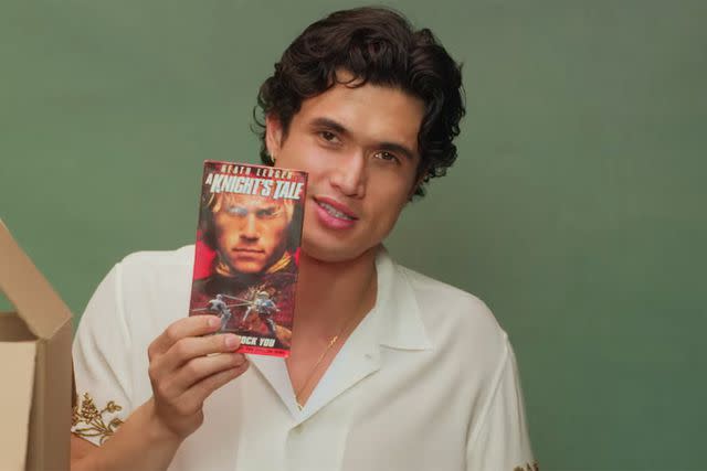 Charles Melton with a VHS copy of <em>A Knight's Tale</em> (2001)