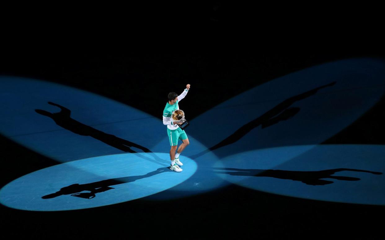 Serbia's Novak Djokovic celebrates with the Open trophy after winning his final match against Russia's Daniil Medvedev  - Reuters