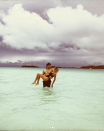 <p>“The sun outsmarted rainy season this afternoon and lit the ocean up like a neon sign,” the newlywed gushed as she posed in the waters of Bora Bora with her husband, Morgan Evans. “Soaking up our last day in this heavenly place.” (Photo: <a rel="nofollow noopener" href="https://www.instagram.com/p/BdrIWIZl6HD/?taken-by=kelseaballerini" target="_blank" data-ylk="slk:Kelsea Ballerini via Instagram;elm:context_link;itc:0;sec:content-canvas" class="link ">Kelsea Ballerini via Instagram</a>) </p>