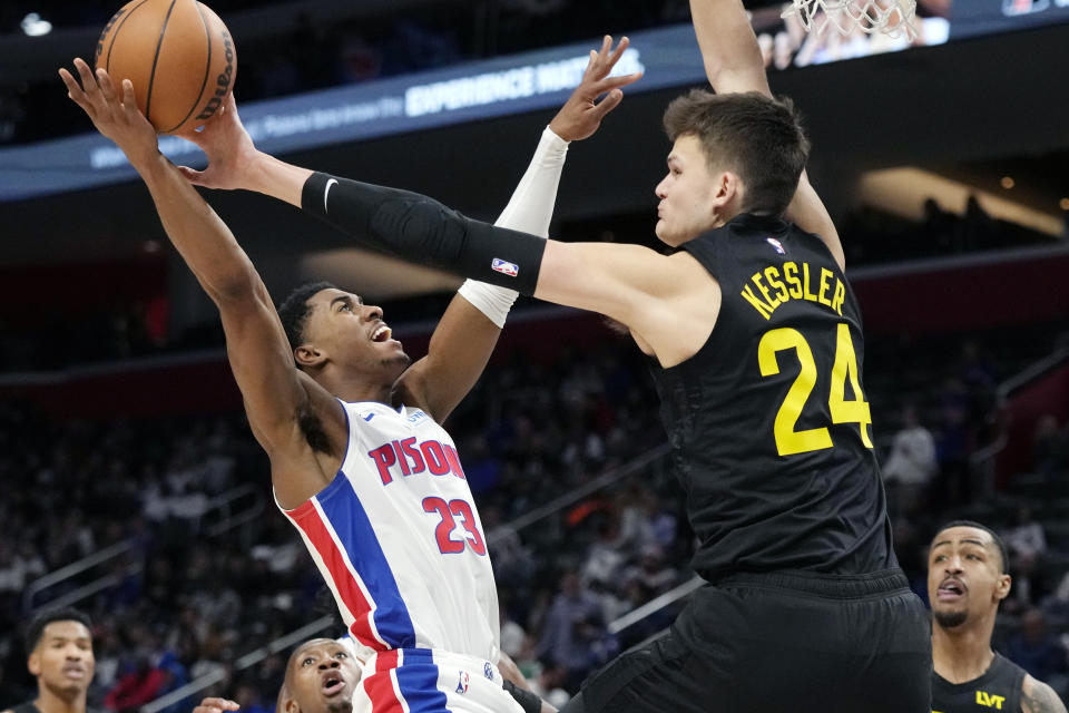 Utah Jazz center Walker Kessler (24) blocks a shot by Detroit Pistons guard Jaden Ivey (23) during the first half of an NBA basketball game, Thursday, Dec. 21, 2023, in Detroit. (AP Photo/Carlos Osorio)