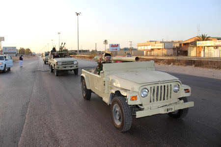 Military vehicles of members of the Libyan internationally recognised government forces head out from Misrata to front line in Tripoli, Misrata, Libya May 10, 2019. REUTERS/Ayman Al-Sahili