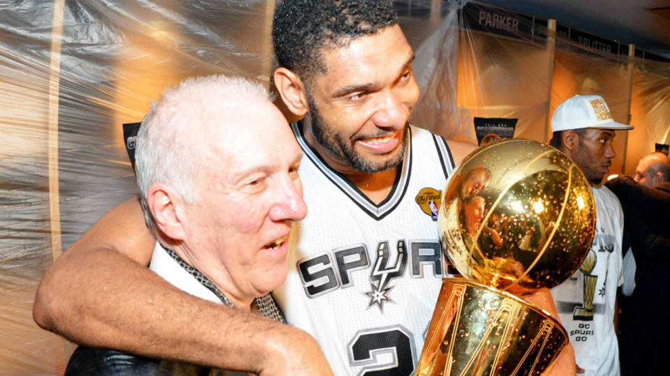 San Antonio Spurs coach is pictured with Tim Duncan after winning the 2014 NBA Finals.