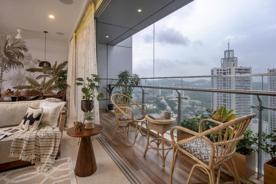 Laid-back, cosy furniture in the balconies encourages the residents to make the most of semi-open spaces in the living room and master bedroom.