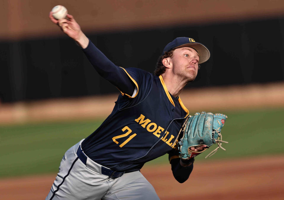 Moeller's starting pitcher Kellan Klosterman (21) throws during their baseball game against Mason Saturday, April 20, 2024.