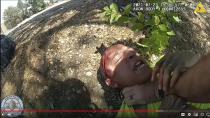 EDS NOTE GRAPHIC CONTENT In this Friday, July 23, 2021, video image released by the Aurora Police Department shows police body camera footage of Aurora police officer using his pistol to beat a man he was trying to take into custody, choking him and threatening to kill him in Aurora, Colo.The Associated Press is not naming the man. He did not suffer serious injury but was taken to a hospital for welts and a cut on his head that required six stitches, police said. Authorities didn't say if he will face charges for an outstanding warrant on a probation violation. It is not clear what race or ethnicity he identifies as, but he appears in the video to be a person of color. (Aurora Police Department via AP)