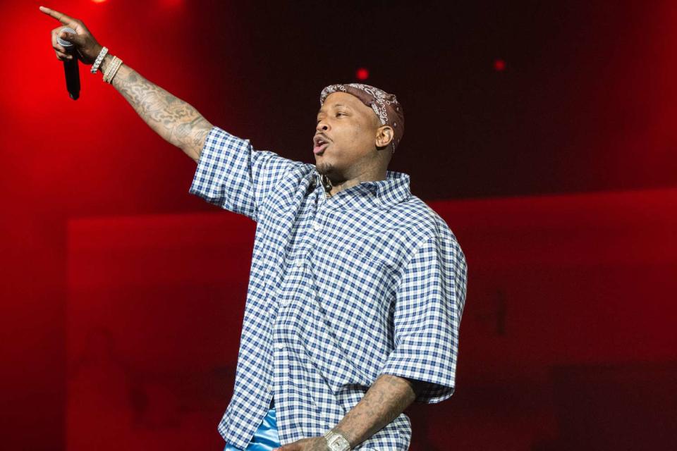 <p>Scott Dudelson/Getty</p> Rapper YG performs onstage during the first day of Rolling Loud Los Angeles 2023 at Hollywood Park Grounds in March 2023 in Inglewood, California