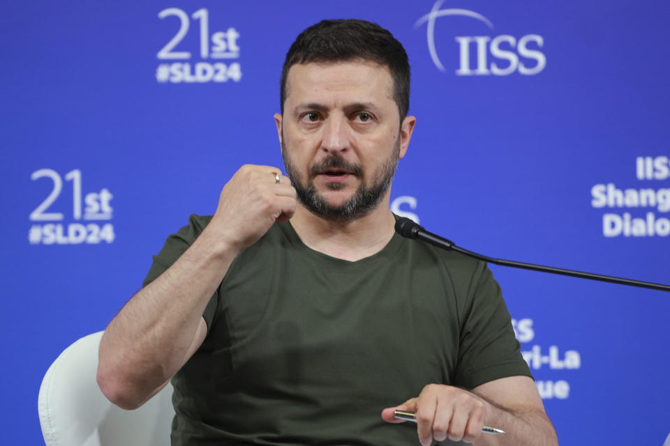 Ukraine's President Volodymyr Zelenskyy speaks during a press conference after the 21st Shangri-La Dialogue summit at the Shangri-La Hotel in Singapore, Sunday, June 2, 2024. Zelenskyy urged a group of top defense officials at Asia’s premier security conference on Sunday to attend an upcoming peace summit, saying Ukraine was ready to hear “various proposals and thoughts” on ending the war with Russia.(AP Photo/Vincent Thian)