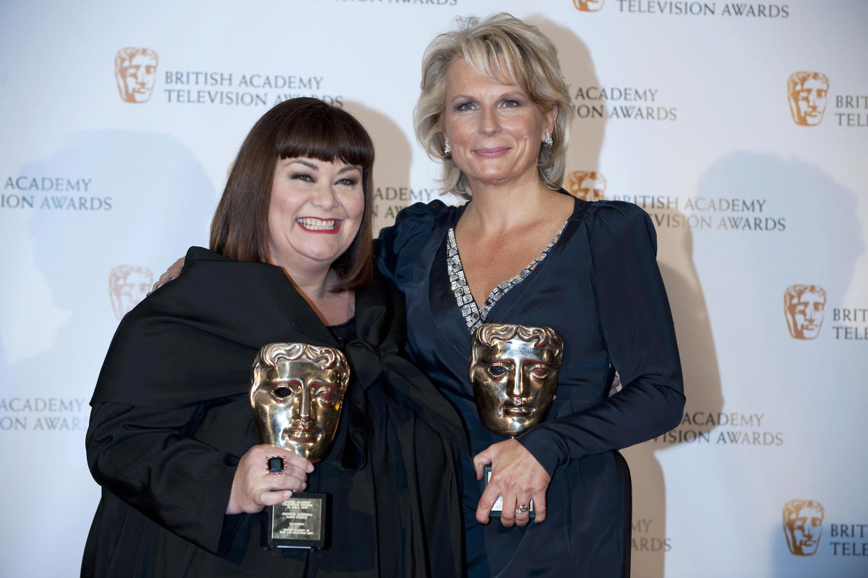 British actress Dawn French (L) and Jennifer Saunders (R) pose with their Fellowship British Academy Television Award (BAFTA) in Central London on April 26, 2009. AFP PHOTO/Ben Stansall (Photo credit should read BEN STANSALL/AFP/Getty Images)