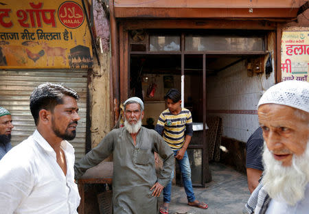 A muslim meat shop owner looks on outside his closed shop in Gurugram, Haryana, India March 29, 2017. REUTERS/Cathal McNaughton
