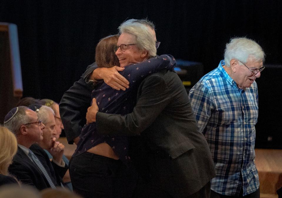 Congregants hug during an event to show solidarity for Israel during a gathering at Congregation B'Nai Israel in Boca Raton, Florida on October 10, 2023.