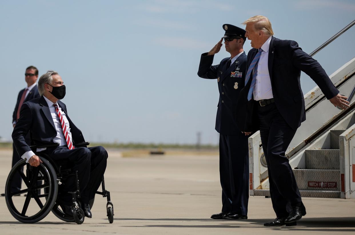 Donald Trump is greeted by governor Greg Abbott on a visit to Texas: REUTERS