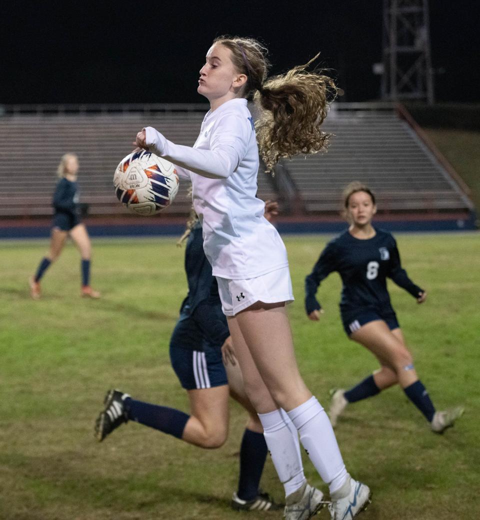 Ella Younger (8) takes control of the ball during the Booker T. Washington vs Escambia girls soccer game at Escambia High School in Pensacola on Friday, Jan. 6, 2023.
