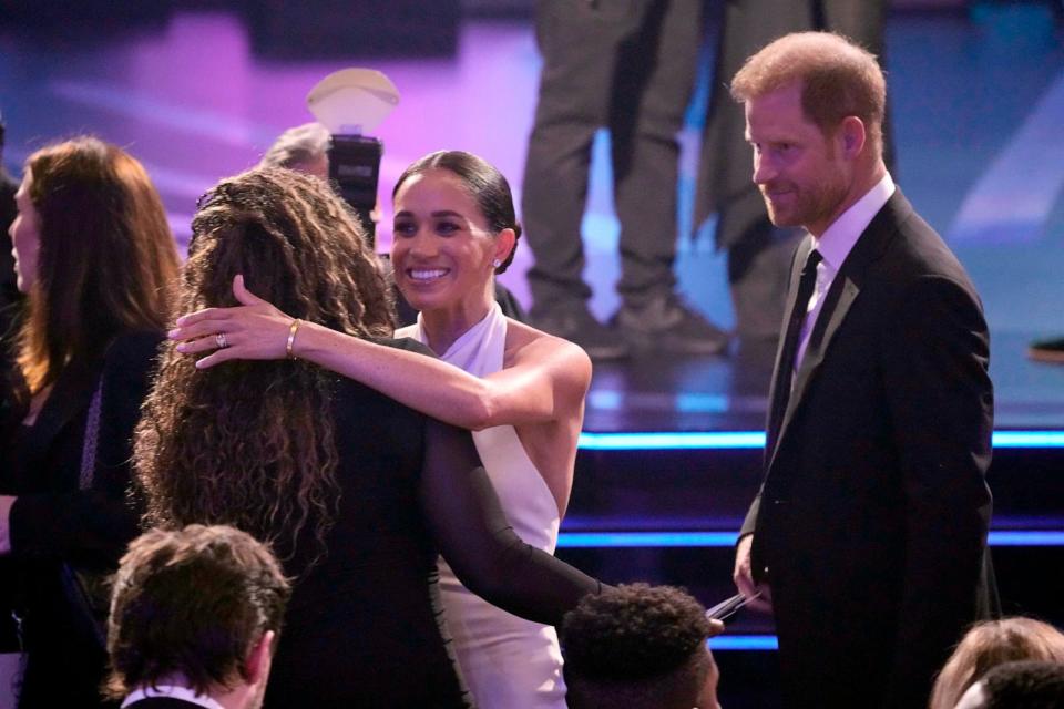 PHOTO: Meghan Markle, center and Prince Harry, right, arrive at the ESPY awards on July 11, 2024, at the Dolby Theatre in Los Angeles.  (Mark J. Terrill/AP)