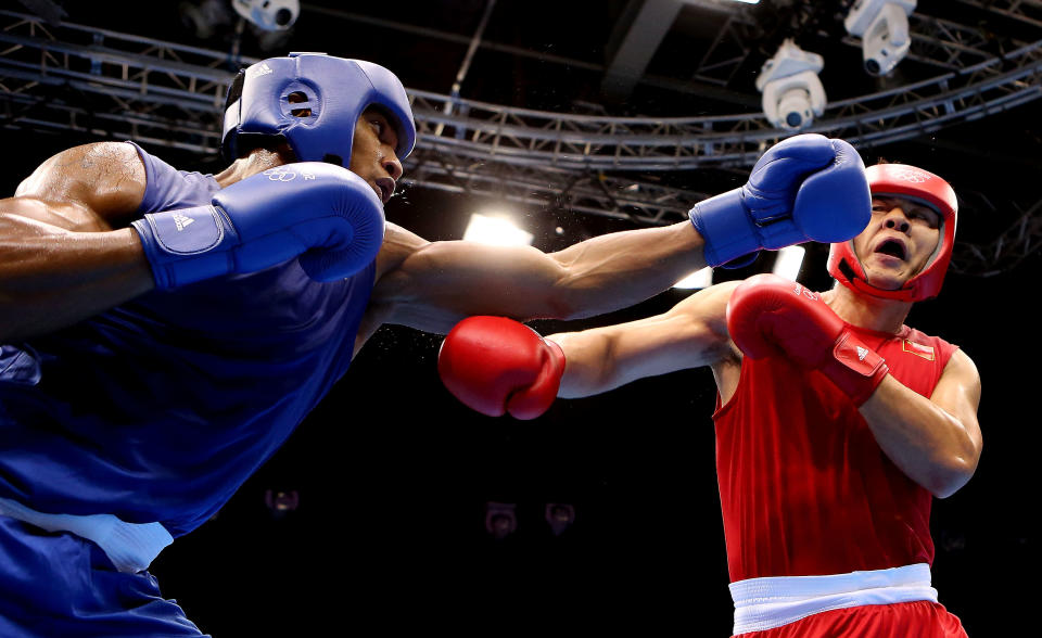 LONDON, ENGLAND - AUGUST 06: Anthony Joshua of Great Britain (L) in action with Zhilei Zhang of China during the Men's Super Heavy ( 91kg) on Day 10 of the London 2012 Olympic Games at ExCeL on August 6, 2012 in London, England. (Photo by Scott Heavey/Getty Images)