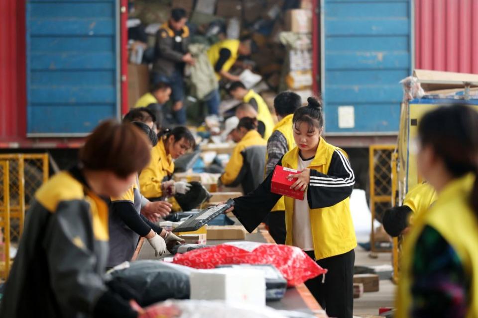 Employees sorting packages ahead of Singles Day in Huaibei in China's eastern Anhui province on Nov. 9, 2017.