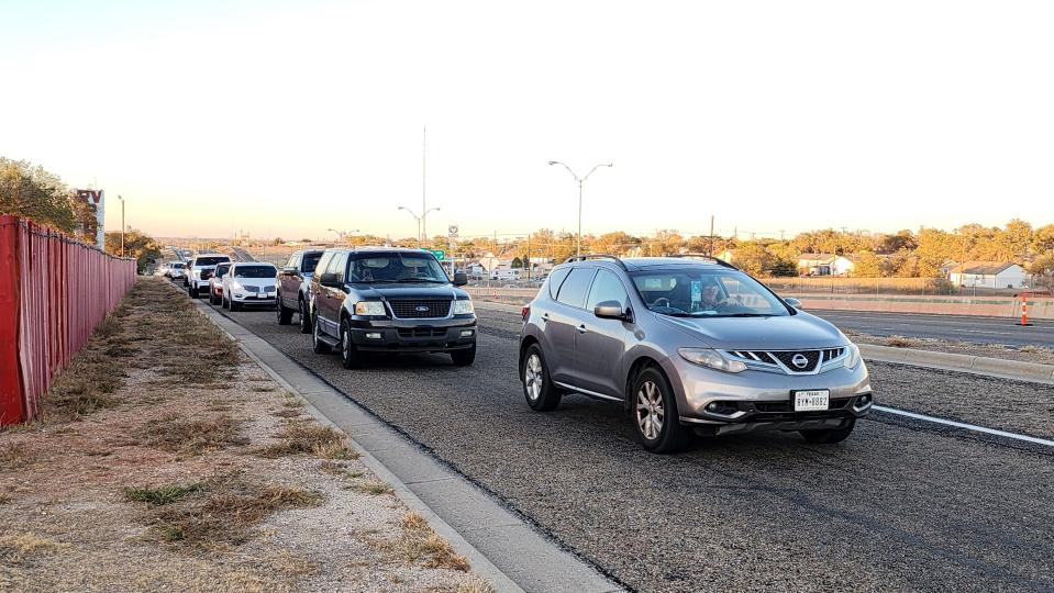Cars are backed up all the way past Thompson Park Friday night at the Tascosa Drive-in's final show in Amarillo.