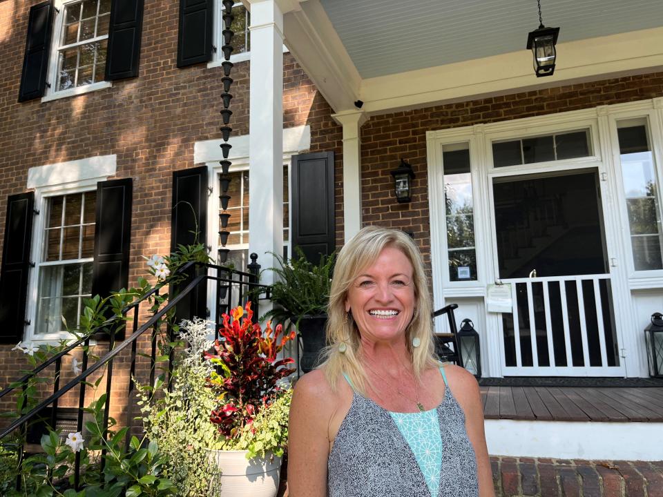 Anne T. White, the owner and proprietor of the Boyd-Harvey House, stands in front of the historic structure on Aug. 19.