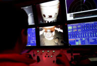 An employee operates a submersible robot camera at the Centenario deep-water oil platform in the Gulf of Mexico off the coast of Veracruz, Mexico January 17, 2014. REUTERS/Henry Romero