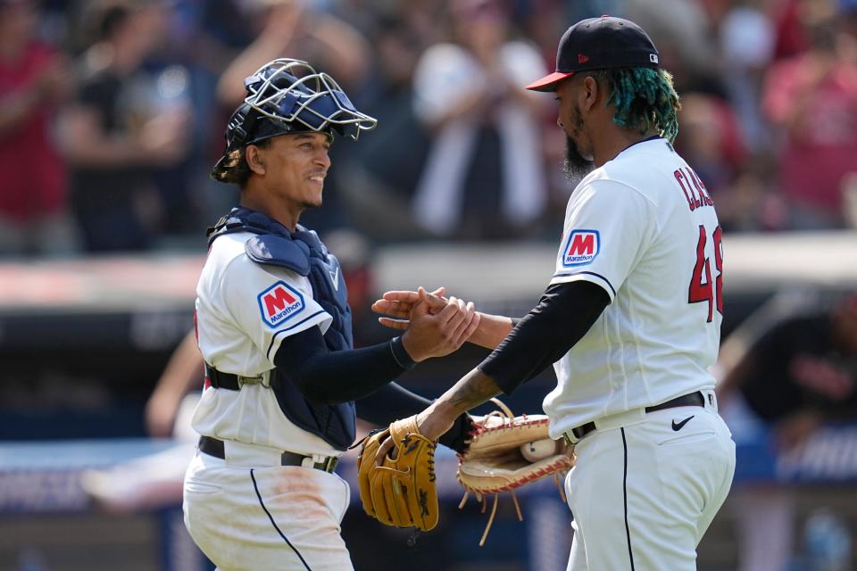 Cleveland Guardians catcher Bo Naylor, left, and relief pitcher Emmanuel Clase celebrate after the Guardians defeated the Toronto Blue Jays on Aug. 10 in Cleveland.