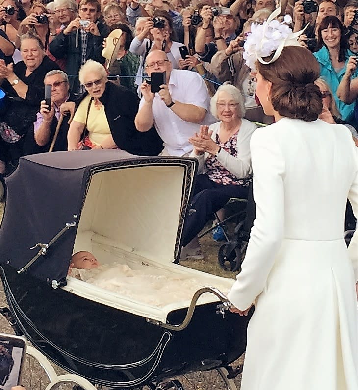 Princess Charlotte being pushed by her Mother the Duchess of Cambridge at her Christening at Sandringham
