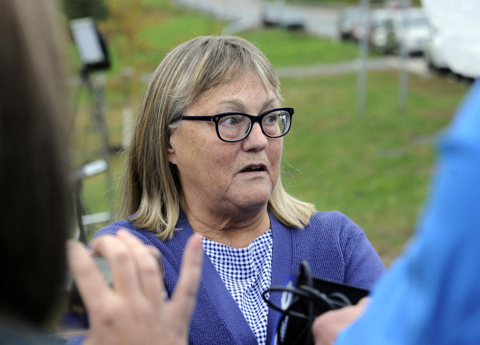 Barbara Douglas, of Danamora, N.Y., talks to reporters about her four family members who died in Saturday's fatal limousine crash in Schoharie, N.Y., Sunday, Oct. 7, 2018. A limousine loaded with revelers headed to a 30th birthday party blew a stop sign at the end of a highway and slammed into an SUV parked outside a store, killing all people in the limo and a few pedestrians, officials and relatives of the victims said Sunday. (AP Photo/Hans Pennink)