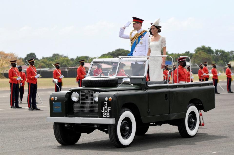 Prince William and Catherine, Duchess of Cambridge ride in a vintage Land Rover on the sixth day of their tour of the Caribbean in Kingston, Jamaica (Reuters)