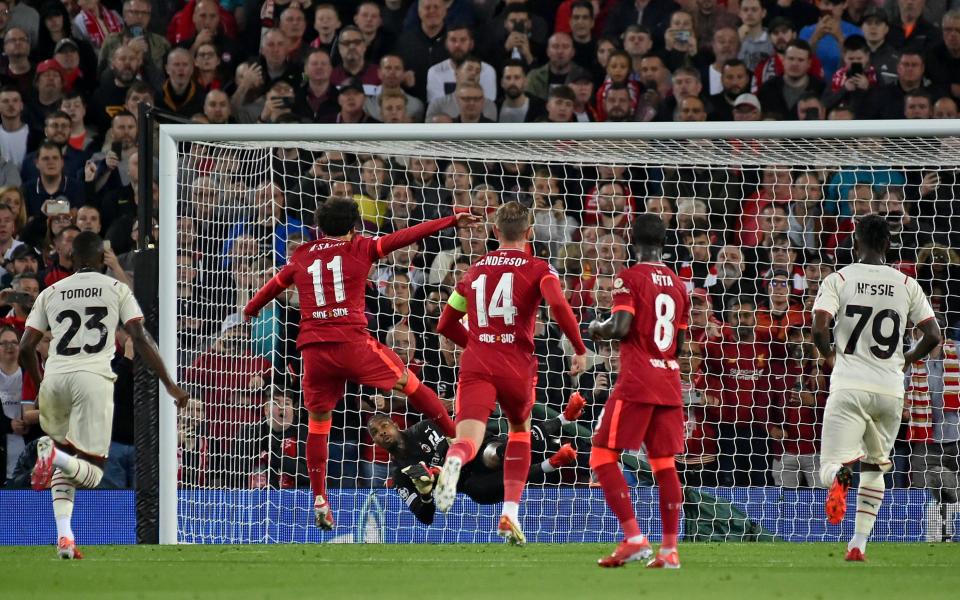 Liverpool's Mohamed Salah has his penalty saved by AC Milan's goalkeeper Mike Maignan during the Champions League Group B soccer match between Liverpool and AC Milan  - AP