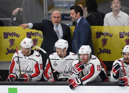 May 30, 2018; Las Vegas, NV, USA; Washington Capitals head coach Barry Trotz (top left) talks with an assistant in the third period in game two of the 2018 Stanley Cup Final against the Vegas Golden Knights at T-Mobile Arena. Stephen R. Sylvanie-USA TODAY Sports