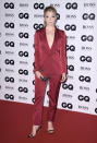 <p>A traditional suit is never a wrong look for a woman, as proven by the ‘Game of Thrones’ star’s plunging burgundy two-piece.<br><i>[Photo: Getty]</i> </p>