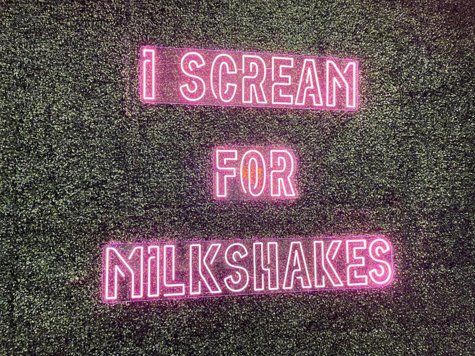 The newly opened Famous Milkshake Bar at West Town Mall features several retro-style neon signs inside the store, like this one shown on Aug. 20, 2022.