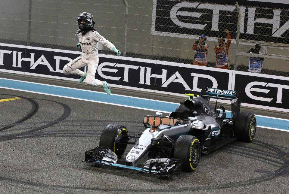 FILE - In this Sunday, Nov. 27, 2016 file photo Mercedes F1 driver Nico Rosberg of Germany celebrates after finishing second to win the 2016 world championship during the Emirates Formula One Grand Prix at the Yas Marina racetrack in Abu Dhabi, United Arab Emirates. (AP Photo/Luca Bruno, File)