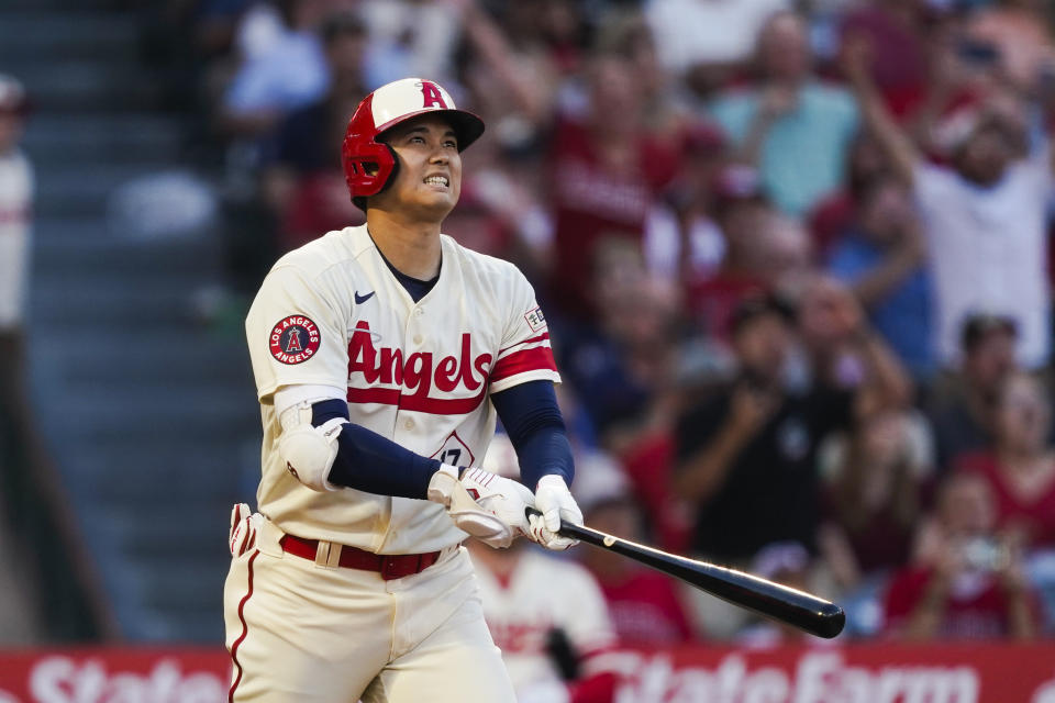 Los Angeles Angels designated hitter Shohei Ohtani watches his grand slam during the second inning of a baseball game against the Tampa Bay Rays, Friday, Aug. 18, 2023, in Anaheim, Calif. Hunter Renfroe, Luis Rengifo, and Nolan Schanuel also scored. (AP Photo/Ryan Sun)