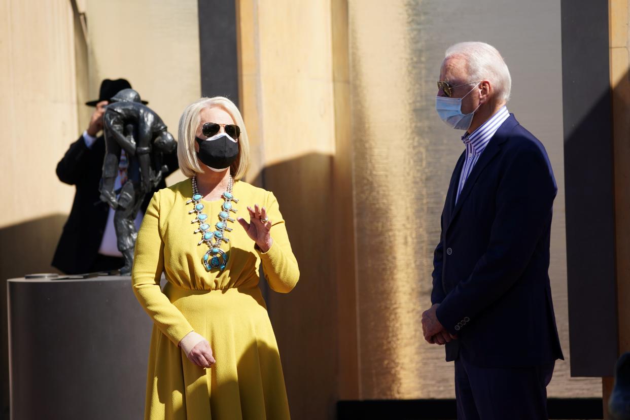 Joe Biden listens to Cindy McCain, as they pay their respects to American Indian veterans during a campaign stop at the American Indian Veterans National Memorial (REUTERS)