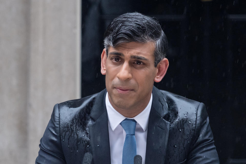 LONDON, UNITED KINGDOM - MAY 22: British Prime Minister Rishi Sunak makes a statement as raining outside 10 Downing Street announcing UK general election will take place on 4 July in London, United Kingdom on May 22, 2024. (Photo by Wiktor Szymanowicz/Anadolu via Getty Images)