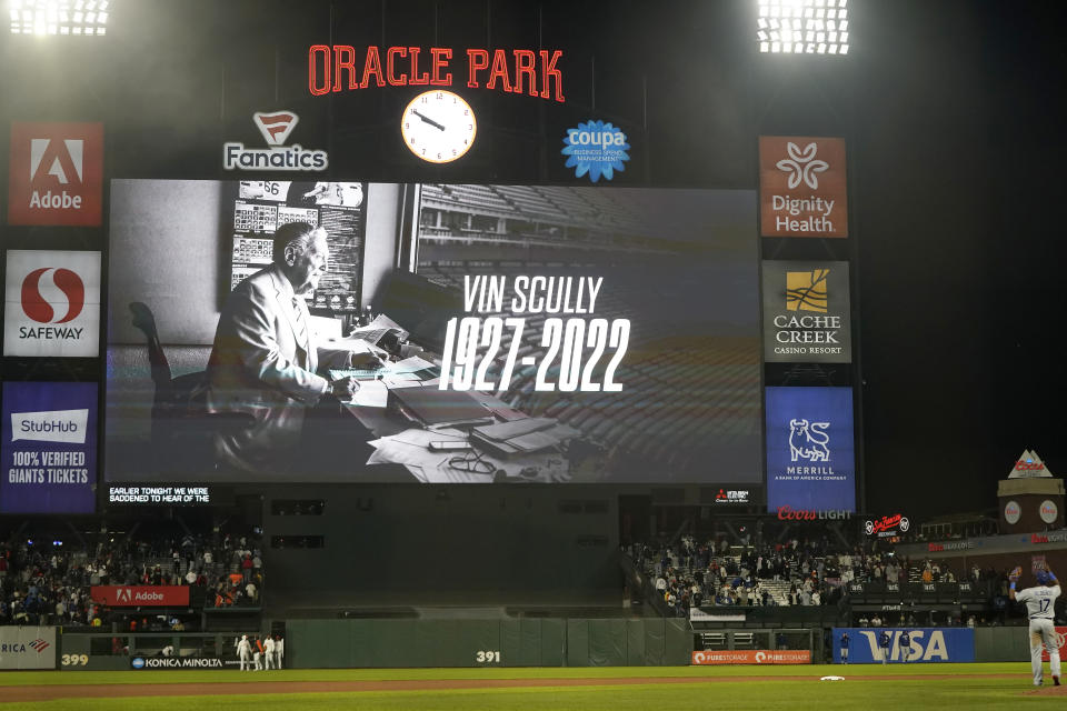 The scoreboard at Oracle Park shows a message for broadcaster Vin Scully after the Los Angeles Dodgers defeated the San Francisco Giants in a baseball game in San Francisco, Tuesday, Aug. 2, 2022. (AP Photo/Jeff Chiu)