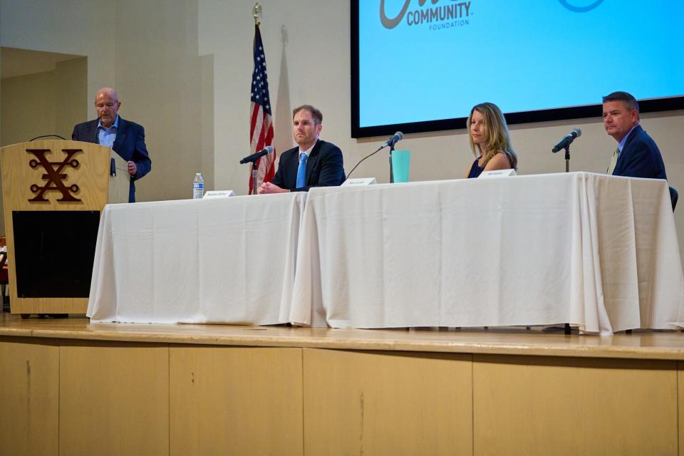 Don Henninger (left), Stephen Richer, Kori Lorick and Bill Gates (right) stand and sit on stage for the Follow The Ballot event at the Arizona Heritage Center theater in Tempe on Nov. 2, 2022.