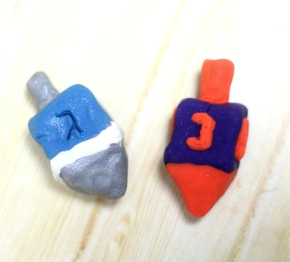 <p>Every Jewish kid learns the tune early: “I have a little dreidel, I made it out of clay…” Well, you can actually make that happen with this clay dreidel project that really spins.</p><p><em><a href="https://www.momsandcrafters.com/how-to-make-a-dreidel-out-of-clay/" rel="nofollow noopener" target="_blank" data-ylk="slk:Get the tutorial at Moms and Crafters;elm:context_link;itc:0;sec:content-canvas" class="link ">Get the tutorial at Moms and Crafters</a></em></p>