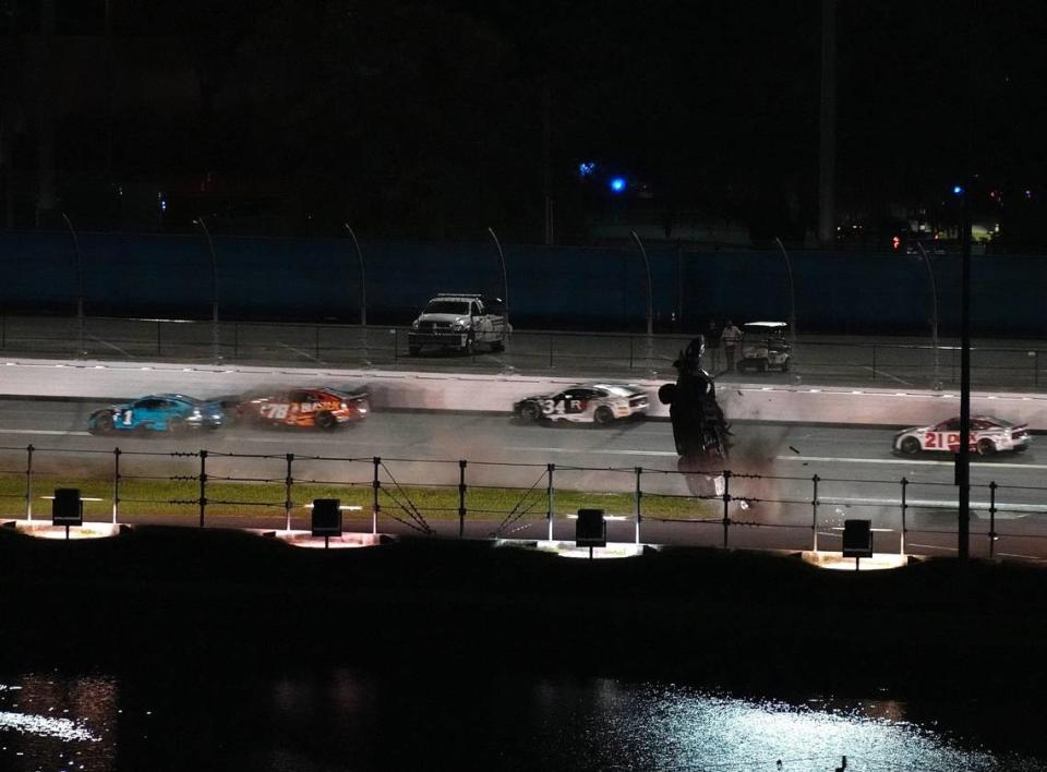 Ryan Preece goes crashing through the grass on the backstretch after a crash in the closing laps of the Coke Zero Sugar 400 on Saturday night in Daytona.