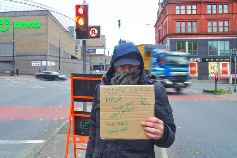 Jason Dunne, asking for help at the junction between Bury New Road and Trinity Way -Credit:MEN