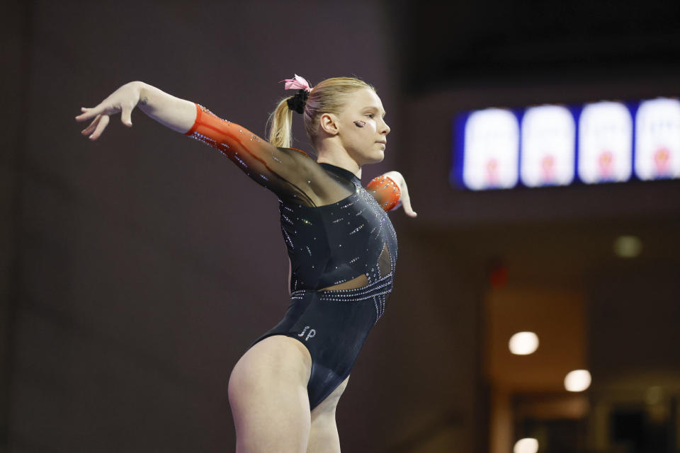 FILE -Oregon State's Jade Carey competes on the balance beam during an NCAA gymnastics meet Saturday, Jan. 6, 2024, in Las Vegas. Carey, the 2020 Olympic champion on floor exercise, is competing for Oregon State in the all-around at this week's NCAA Championships. (AP Photo/Stew Milne, File)