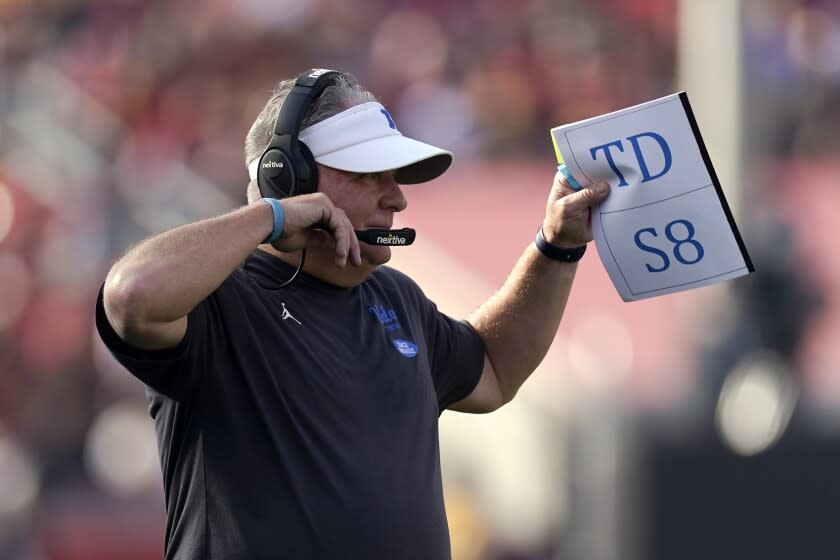 UCLA head coach Chip Kelly gestures during the first half of an NCAA college football game.