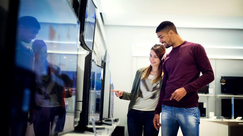 couple shopping for a television