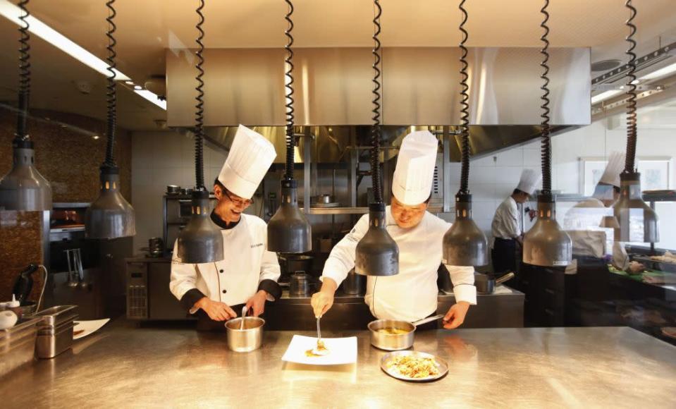 Chefs prepare a dish at the Marco Polo restaurant at the Grand Intercontinental Hotel in the Gangnam area of Seoul.