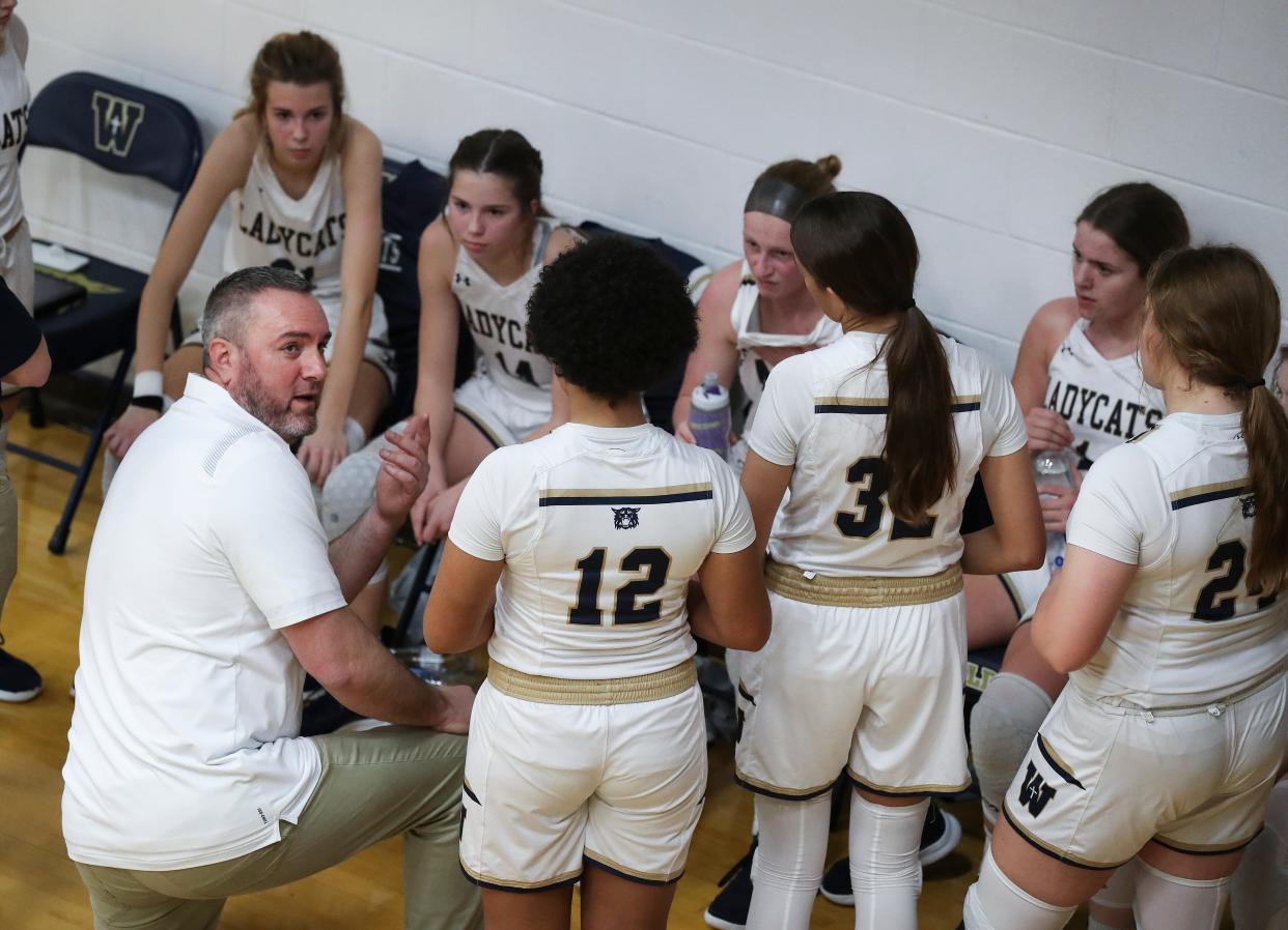 Whitefield Academy head coach Glenn Wathen, left, instructed his team against the Mercy Academy during their game at the Whitefield Academy gymnasium in Louisville, Ky. on Jan. 4, 2022.  